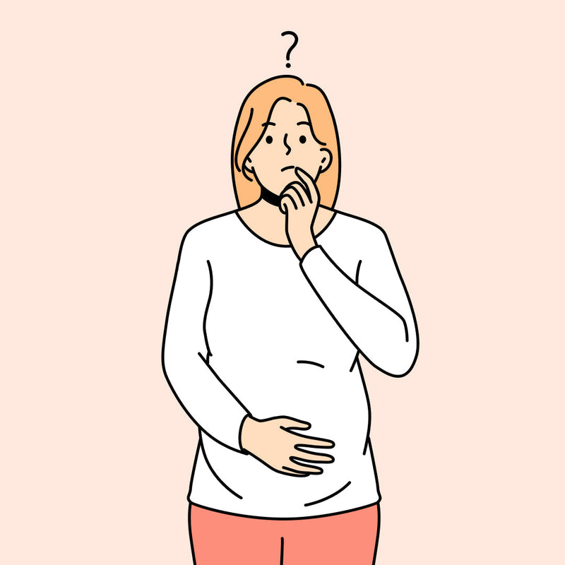 Confused pregnant woman with question mark over her head - breast pump or milk collector?
